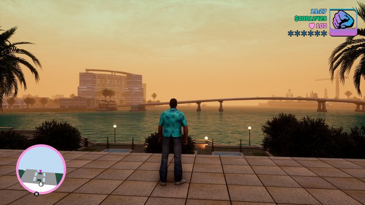 Grand Theft Auto Vice City Definitive Edition Full Version berdiri di pinggir pantai kota Vice City yang di-remake